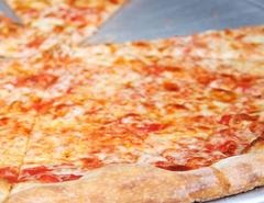 A closeup photograph of a cheese pizza