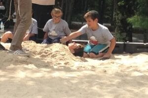 Young boys playing with sand