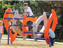 A boy is playing on the playground equipment.