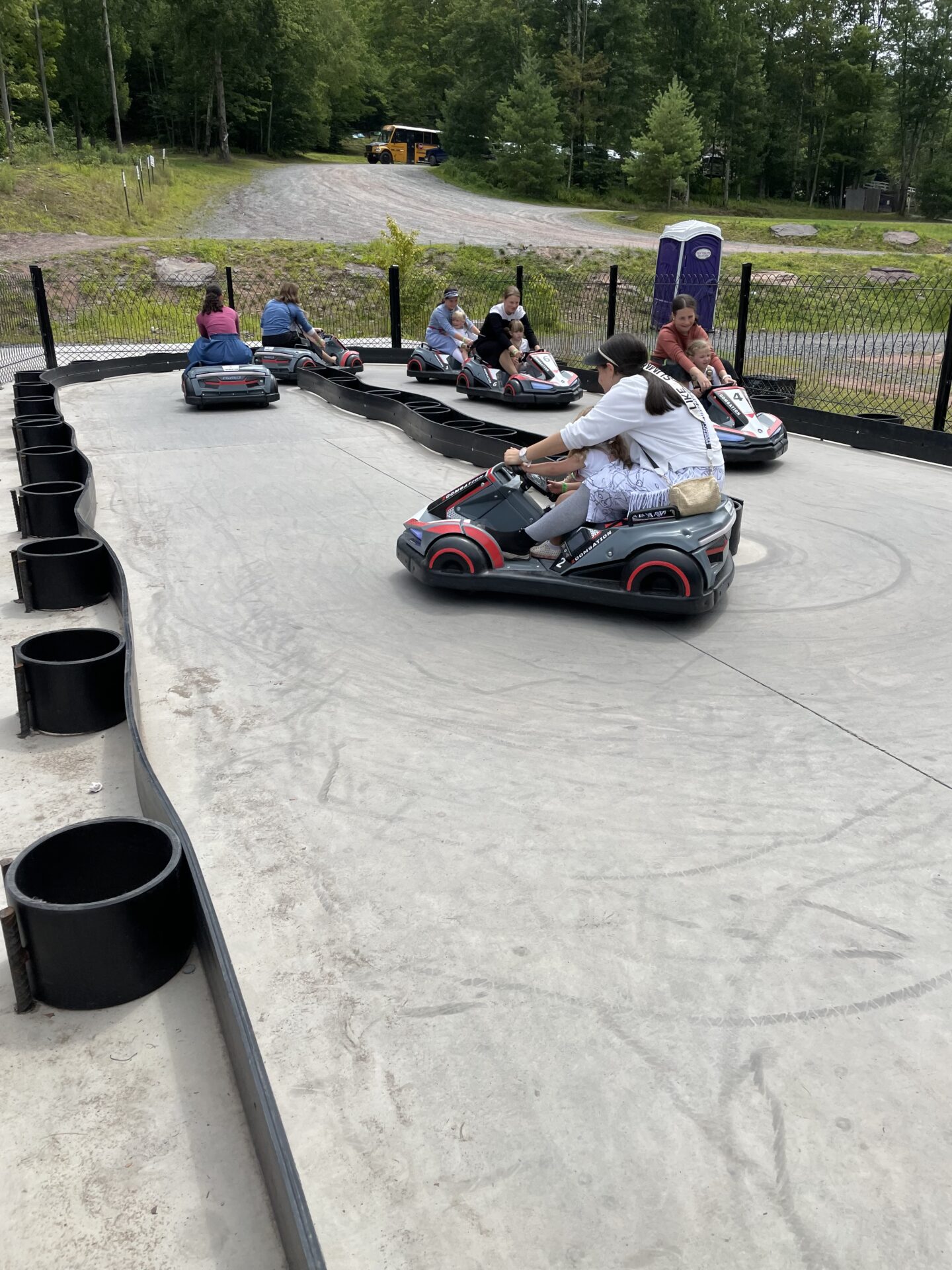 A group of people riding on the side of a road.